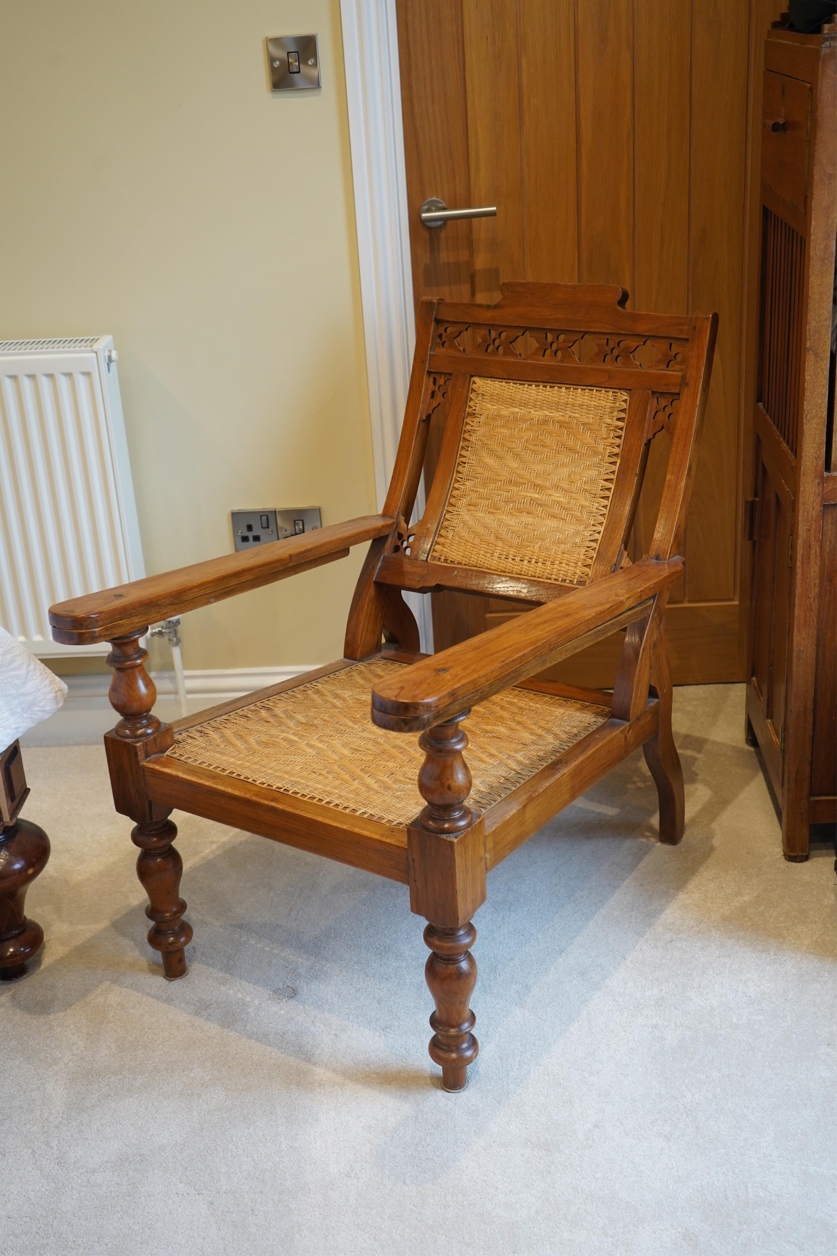 A mid 19th century Anglo Indian teak planter's chair, width 62cm, depth 84cm, height 92cm. Condition - good